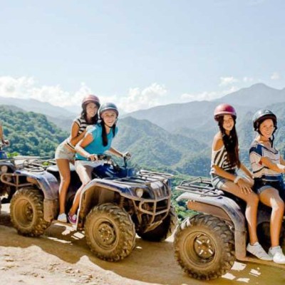 a group of people riding on the back of a truck
