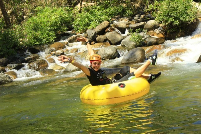 a group of people in a pool of water