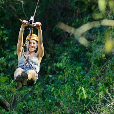 a person standing next to a tree