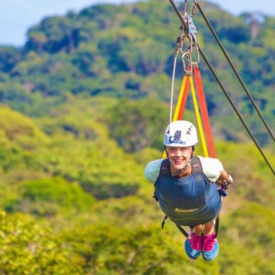 a person standing on a lush green field