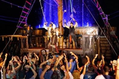 a group of people on a stage in front of a crowd