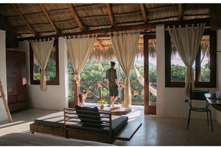 a room filled with furniture and a window