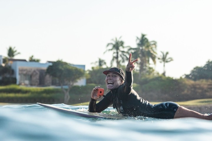 a person riding a surf board in the water