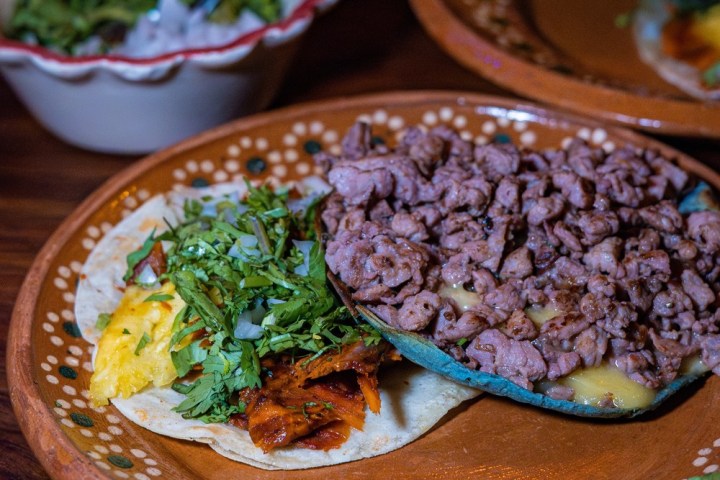 a plate of food on a wooden table