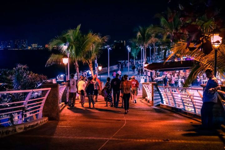 a group of people sitting at night